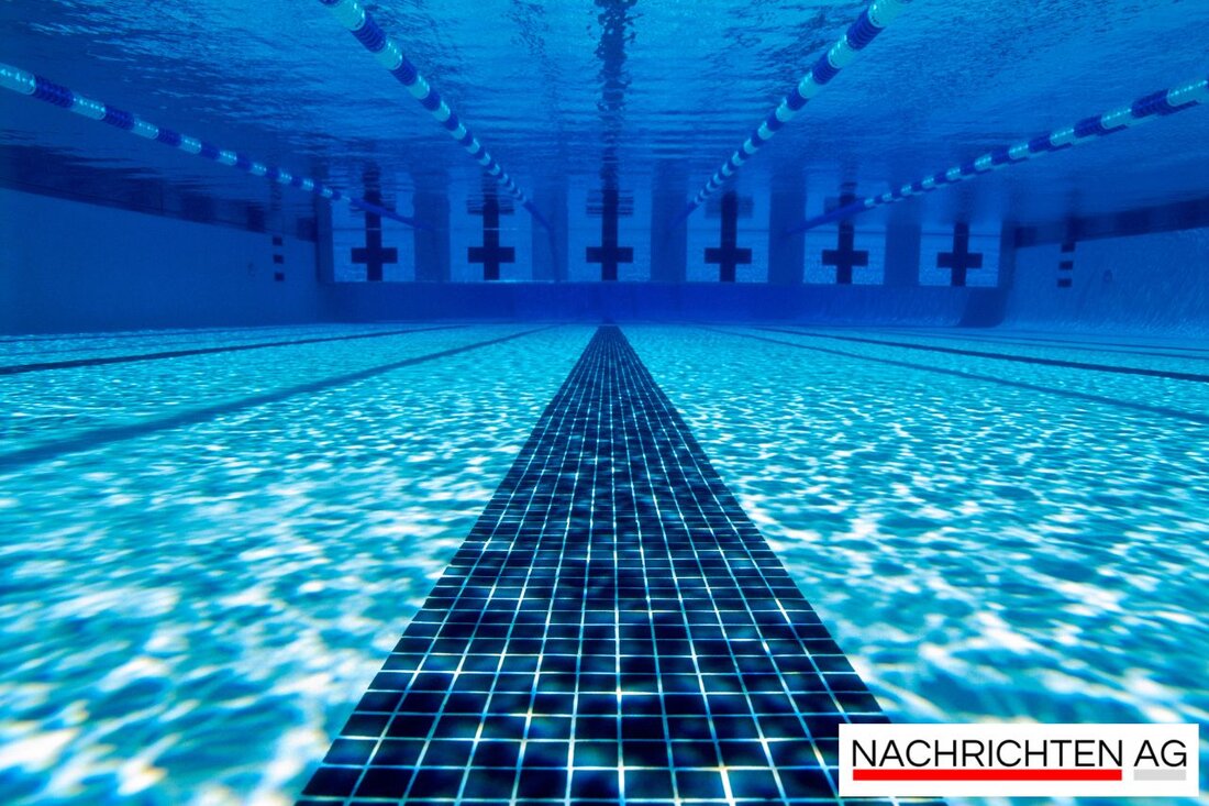 Entdecken Sie das Waldbad Köln-Dünnwald: ein idyllisches Freibad für erholsame Sommertage mit Rutsche und schattenspendenden Bäumen.
